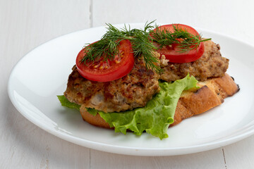 sandwich with cutlet lettuce and tomato slices
