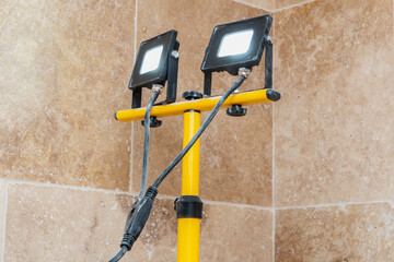 construction repair tools on the background of stone natural tiles