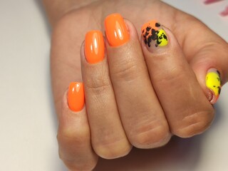 Beautiful nail design on female hands on background.