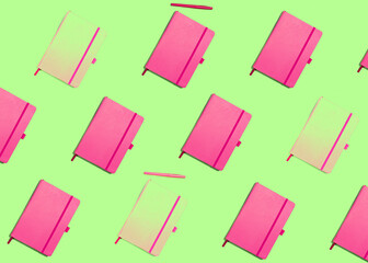 Pattern with pink notebooks on green background, pop style, vivid colors