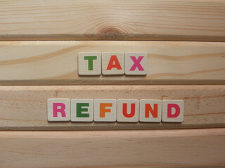 Word Tax Refund on wood background