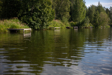 Lake in the village in summer.