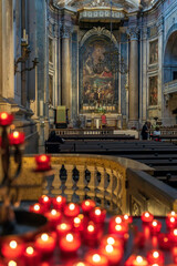 Lisbon, Portugal, October 6, 2019 - Red Votive Candles in Estrela Basilica