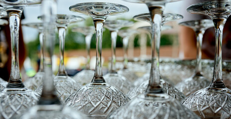 very close legs of wine glasses that stand upside down on the table 