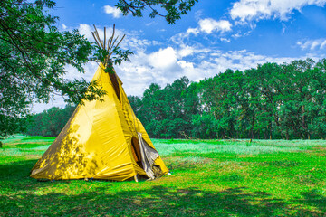 Indian house wigwam. Wigwam teepee in the forest. © Anna