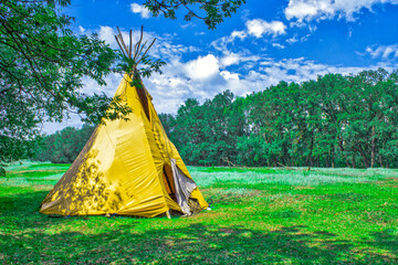 Indian house wigwam. Wigwam teepee in the forest. © Anna