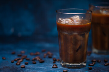 Cold summer drink, coffee with milk, coffee beans, summer mood