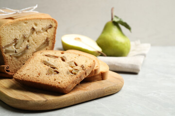 Tasty pear bread on light grey marble table, closeup. Homemade cake
