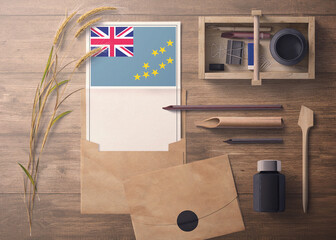 Tuvalu invitation, celebration letter concept. Flag with craft paper and envelope. Retro theme with divide, ink, wooden pen objects.