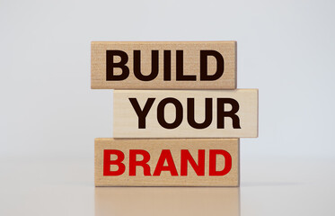 Build your Brand written on wooden blocks with vintage styled background. Branding rebranding...
