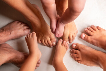 female legs of 4 generations of one family.  baby, child, mom, grandmother, great-grandmother