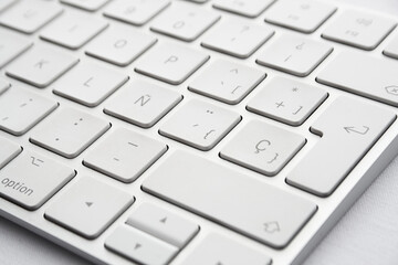 detail sober and minimalist white wireless keyboard, perspective view