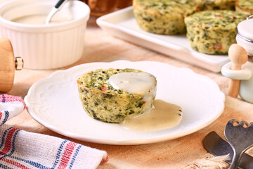 Spinach egg white frittatas on white plate