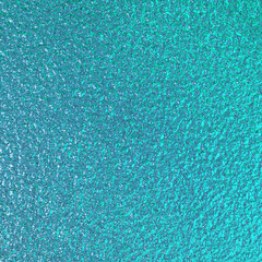 Teal green blue foil paper texture background.