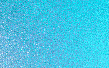 Fototapeta na wymiar Blue green metallic foil paper texture background.