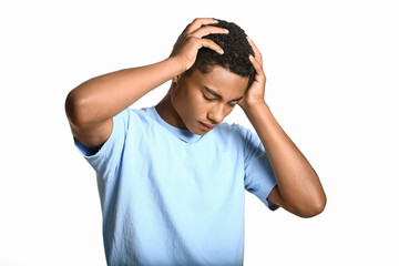 Stressed African-American teenage boy on light background. Stop racism