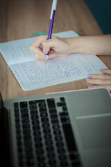 Close up of handwriting on paper, young female hands