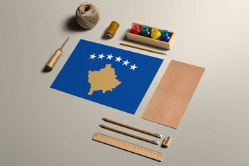 Kosovo calligraphy concept, accessories and tools for beautiful handwriting, pencils, pens, ink, brush, craft paper and cardboard crafting on wooden table.