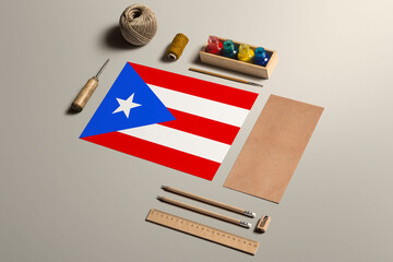 Puerto Rico calligraphy concept, accessories and tools for beautiful handwriting, pencils, pens, ink, brush, craft paper and cardboard crafting on wooden table.