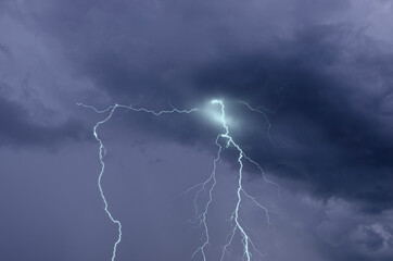 Fototapeta na wymiar Beautiful lightning lines in black rainy clouds