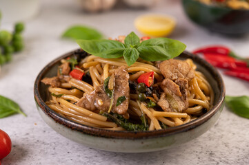 Stir fry the spaghetti put the pork in a bowl.