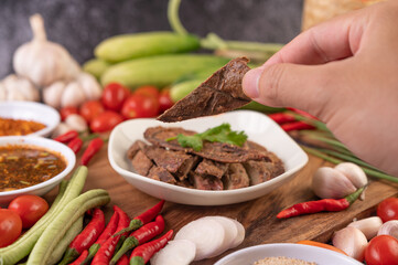 Grilled pork liver in a white plate.