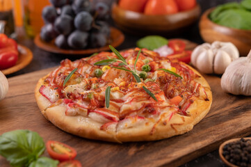 pizza placed on a wooden plate.