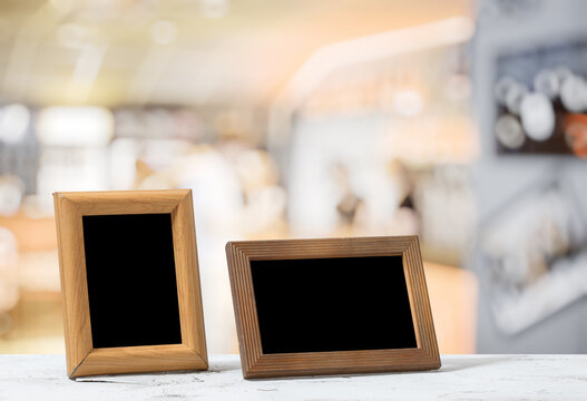 photo frames on the wooden table