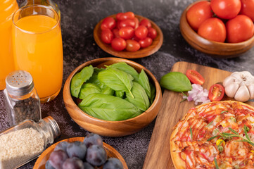 pizza placed on a wooden plate.