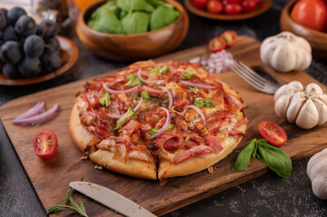 pizza placed on a wooden plate.