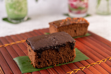 Chocolate cake on banana leaves.