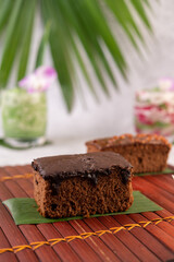 Chocolate cake on banana leaves.