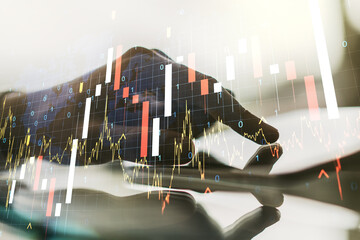 Abstract creative financial graph with world map and with finger clicks on a digital tablet on background, forex and investment concept. Multiexposure