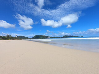 White sand beach with indigo blue sky