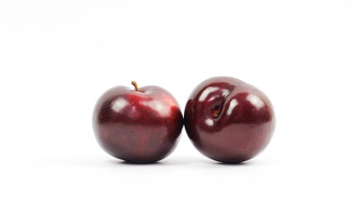 plums on white background