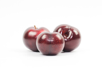 plums on white background