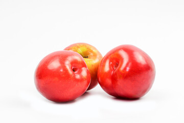 plums on white background