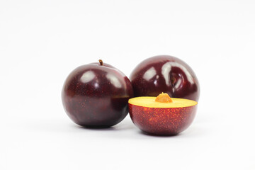 plums on white background