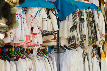 Sale of traditional embroidered clothes in tourist area of Bukovina, Romania