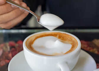 A cup of hot latte coffee