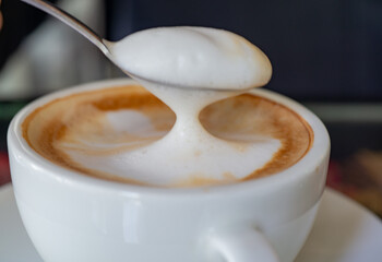 A cup of hot latte coffee
