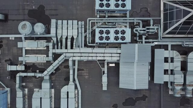 Air Conditioning and Ventilation Systems with Metal Ducting on Rooftop of Building