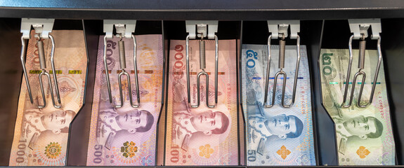 23 July 2020 Pathumthani Thailand Colorful Thai bank notes in the cashier drawer