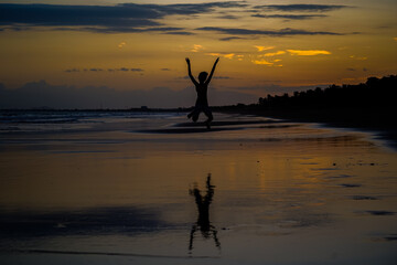 Beautiful silhouette image of Kids playing and enjoying at the Beach in Costa Rica