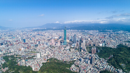 Taipei City Aerial View - Asia business concept image, panoramic modern cityscape building bird’s eye view in morning blue bright sky. Drone photography shot in Taipei, Taiwan.
