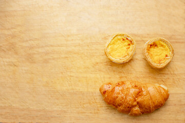 Bread shaped smiley face on a wooden floor