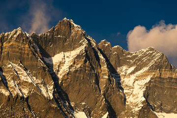 Evening sunset light over Lhotse mountain peak view from Chukung village, Himalaya mountains range,...