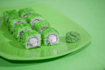 Green sushi on a green plate