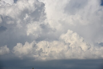 White fluffy clouds on blue sky