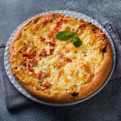 Baked flatbread with cheese and sauce. Homemade pizza.
